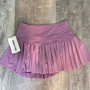 gold hinge tennis skirt! (size small, never worn)